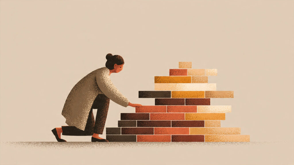 A textured illustration of a woman kneeling and carefully placing bricks to build a stable, colorful pyramid structure against a neutral background.