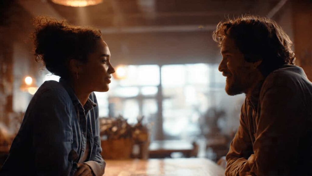 Two people having a calm and open conversation in a supportive setting, symbolizing healthy communication and emotional understanding